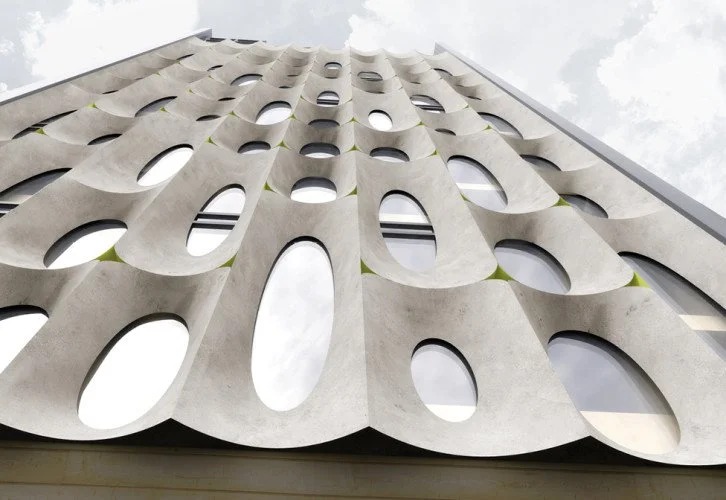 Boutique Hotel, upward view of the scalloped concrete facade panels