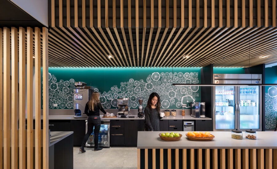 Kendall Square Workspace, wood slat cafe with teal tree ring mural