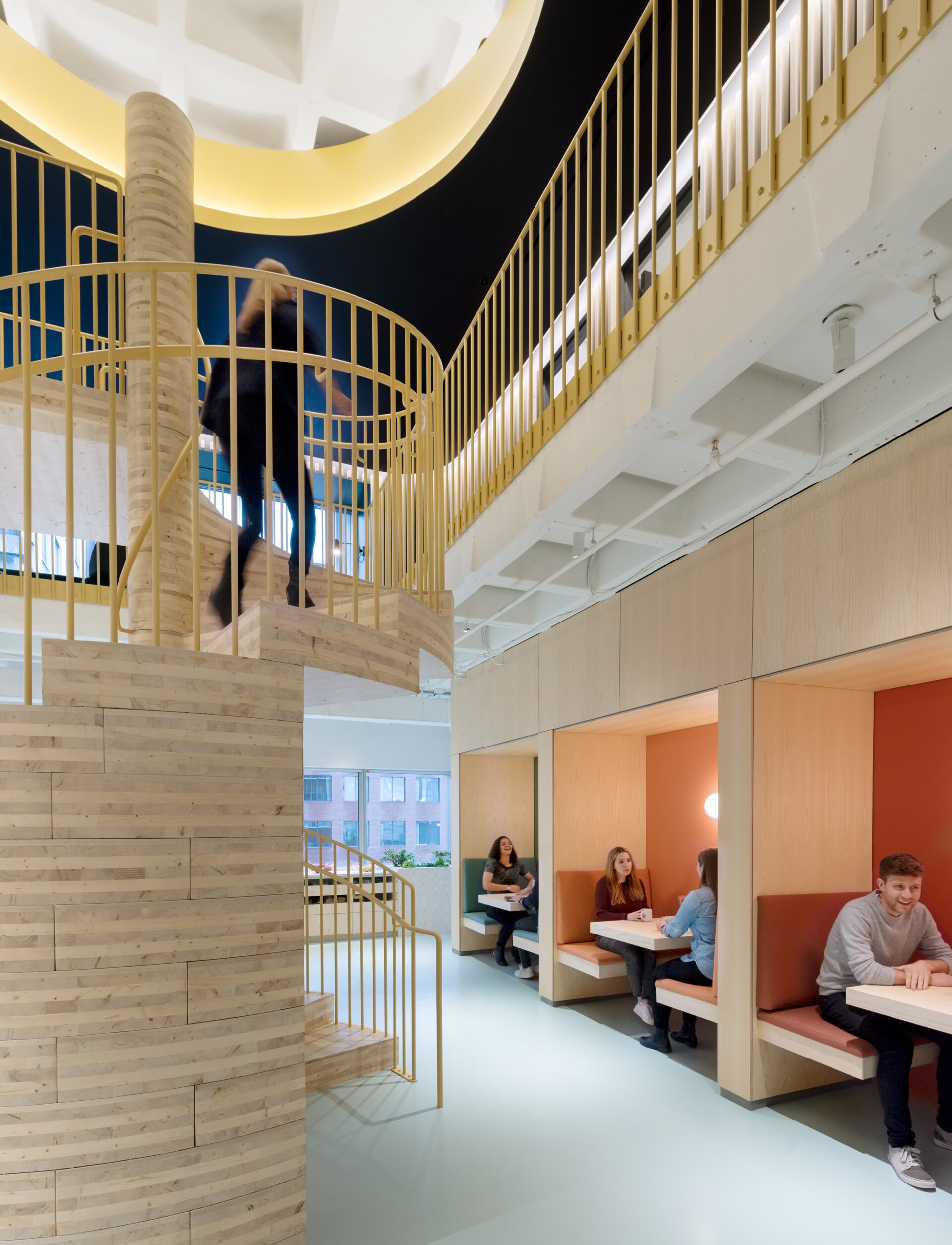 Kendall Square Workspace, spiral stair with dining booths