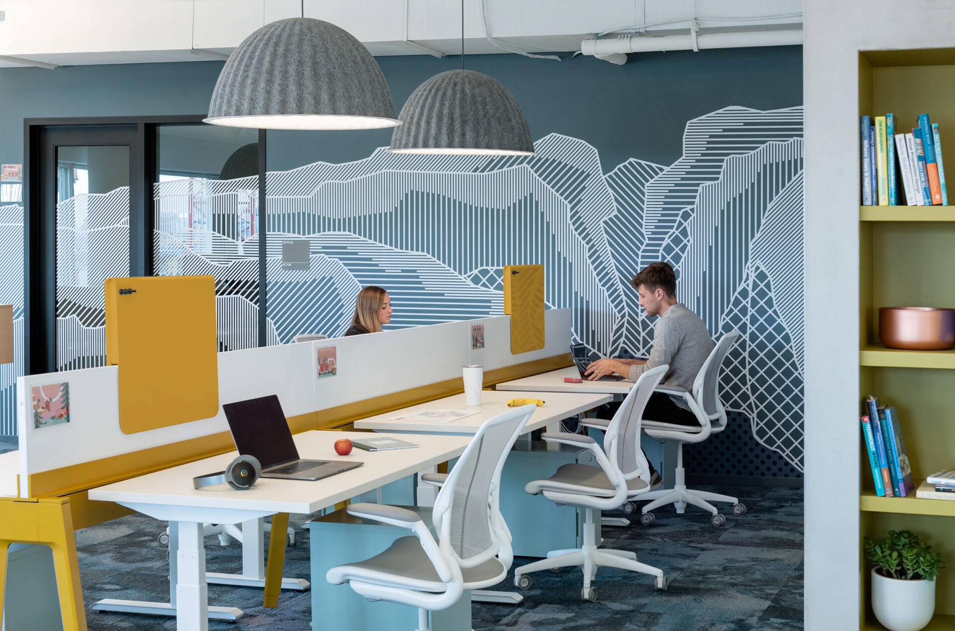 Kendall Square Workspace, open workstations with mountain mural