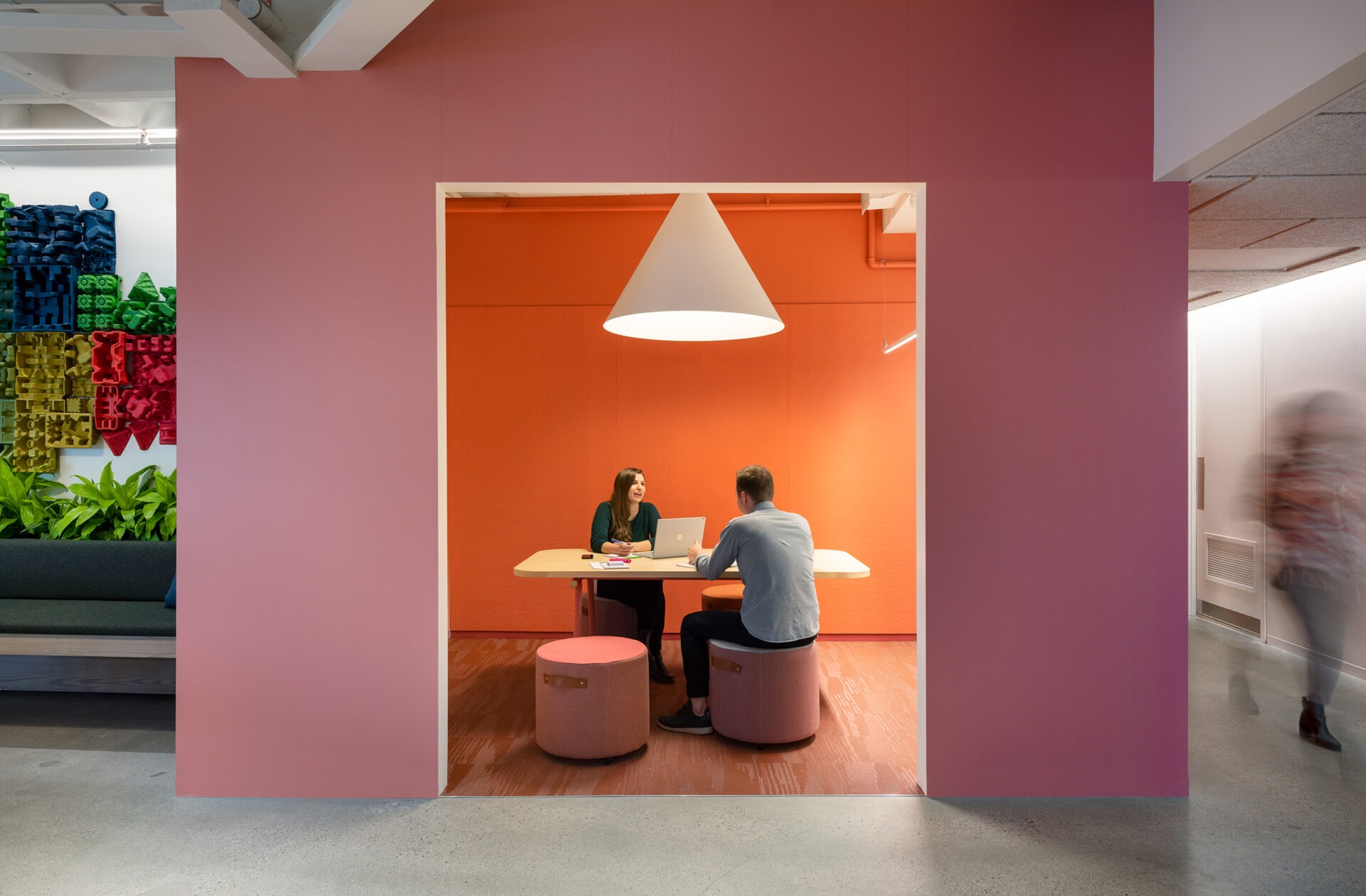 Kendall Square Workspace, pink and orange meeting nook