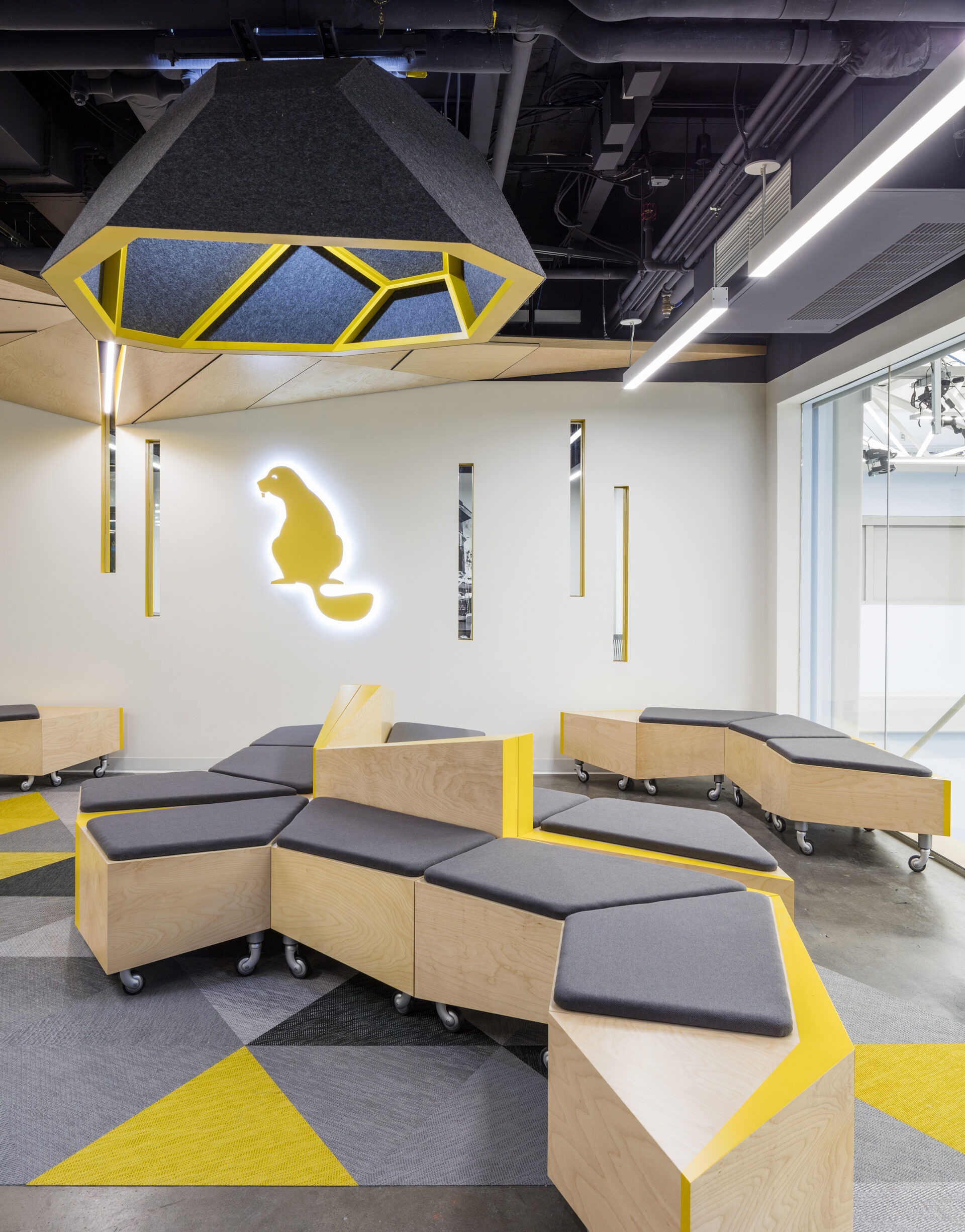MIT Beaver Works AeroAstro, modular seating and beaver logo wall wide view